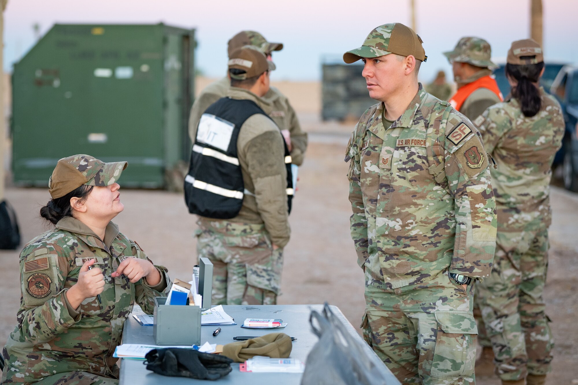 944th Fighter Wing Reserve Citizen Airmen discusses in processing readiness Exercise Desert Hammer 25-1 at Gila Bend Air Force Auxiliary Field, Ariz., Nov. 14, 2024. Exercise Desert Hammer 25-1 emphasizes the U.S. Air Force Reserve’s commitment to readiness by integrating Agile Combat Support and Large Force Exercise capabilities in a contested environment. (U.S. Air Force photo by Tech. Sgt. Tyler J. Bolken)