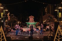U.S. Marines assigned to Marine Band San Diego, Headquarters and Service Battalion, Marine Corps Recruit Depot San Diego, perform at the Little Italy tree lighting event, San Diego, California, Dec. 7, 2024. The Marine Band San Diego’s job is to provide ceremonial music, boost morale and participate in outreach work and attend events and ceremonies. (U.S. Marine Corps photo illustration by Lance Cpl. Janell B. Alvarez)