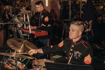 U.S. Marine Corps Sgt. Logan Fox, right, percussionist and Sgt. Nikolas Slattery, pianist both with Marine Band San Diego, Headquarters and Service Battalion, Marine Corps Recruit Depot San Diego, perform at the Little Italy tree lighting event, San Diego, California, Dec. 7, 2024. The Marine Band San Diego’s job is to provide ceremonial music, boost morale and participate in outreach work and attend events and ceremonies. (U.S. Marine Corps photo by Lance Cpl. Janell B. Alvarez)