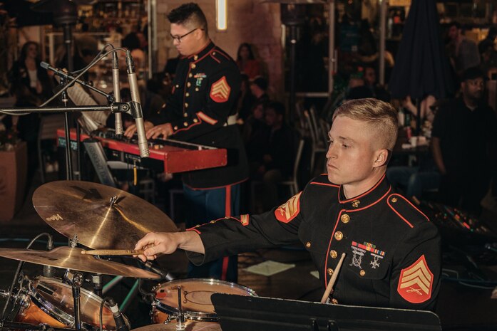 U.S. Marine Corps Sgt. Logan Fox, right, percussionist and Sgt. Nikolas Slattery, pianist both with Marine Band San Diego, Headquarters and Service Battalion, Marine Corps Recruit Depot San Diego, perform at the Little Italy tree lighting event, San Diego, California, Dec. 7, 2024. The Marine Band San Diego’s job is to provide ceremonial music, boost morale and participate in outreach work and attend events and ceremonies. (U.S. Marine Corps photo by Lance Cpl. Janell B. Alvarez)