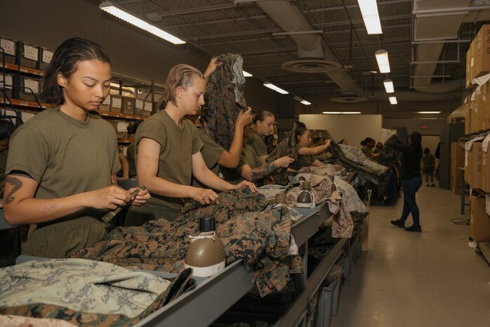 U.S. Marine Corps recruits with Lima Company, 3rd Recruit Training Battalion, follow instructions during their uniform fitting at Marine Corps Recruit Depot San Diego, California, Nov. 27, 2024. Recruits are fitted twice during training, on Training Day 27 in Phase 2 and the sixth day of Marine Week in Phase 4, to ensure their uniforms are ready to be worn properly as Marines. (U.S. Marine Corps photo by Lance Cpl. Janell B. Alvarez)