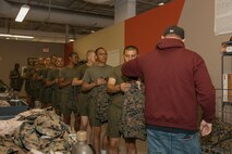 U.S. Marine Corps recruits with Lima Company, 3rd Recruit Training Battalion, are instructed during their uniform fitting at Marine Corps Recruit Depot San Diego, California, Nov. 27, 2024. Recruits are fitted twice during training, on Training Day 27 in Phase 2 and the sixth day of Marine Week in Phase 4, to ensure their uniforms are ready to be worn properly as Marines. (U.S. Marine Corps photo by Lance Cpl. Janell B. Alvarez)