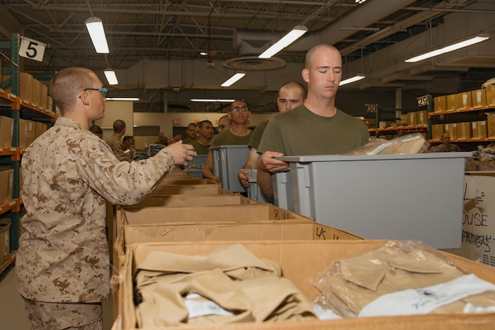 U.S. Marine Corps recruits with Lima Company, 3rd Recruit Training Battalion, are issued uniforms during their uniform fitting at Marine Corps Recruit Depot San Diego, California, Nov. 27, 2024. Recruits are fitted twice during training, on Training Day 27 in Phase 2 and the sixth day of Marine Week in Phase 4, to ensure their uniforms are ready to be worn properly as Marines. (U.S. Marine Corps photo by Lance Cpl. Janell B. Alvarez)