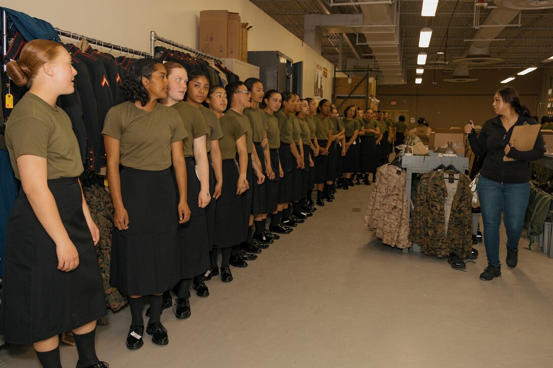 U.S. Marine Corps recruits with Lima Company, 3rd Recruit Training Battalion, are being briefed during their uniform fitting at Marine Corps Recruit Depot San Diego, California, Nov. 27, 2024. Recruits are fitted twice during training, on Training Day 27 in Phase 2 and the sixth day of Marine Week in Phase 4, to ensure their uniforms are ready to be worn properly as Marines. (U.S. Marine Corps photo by Lance Cpl. Janell B. Alvarez)