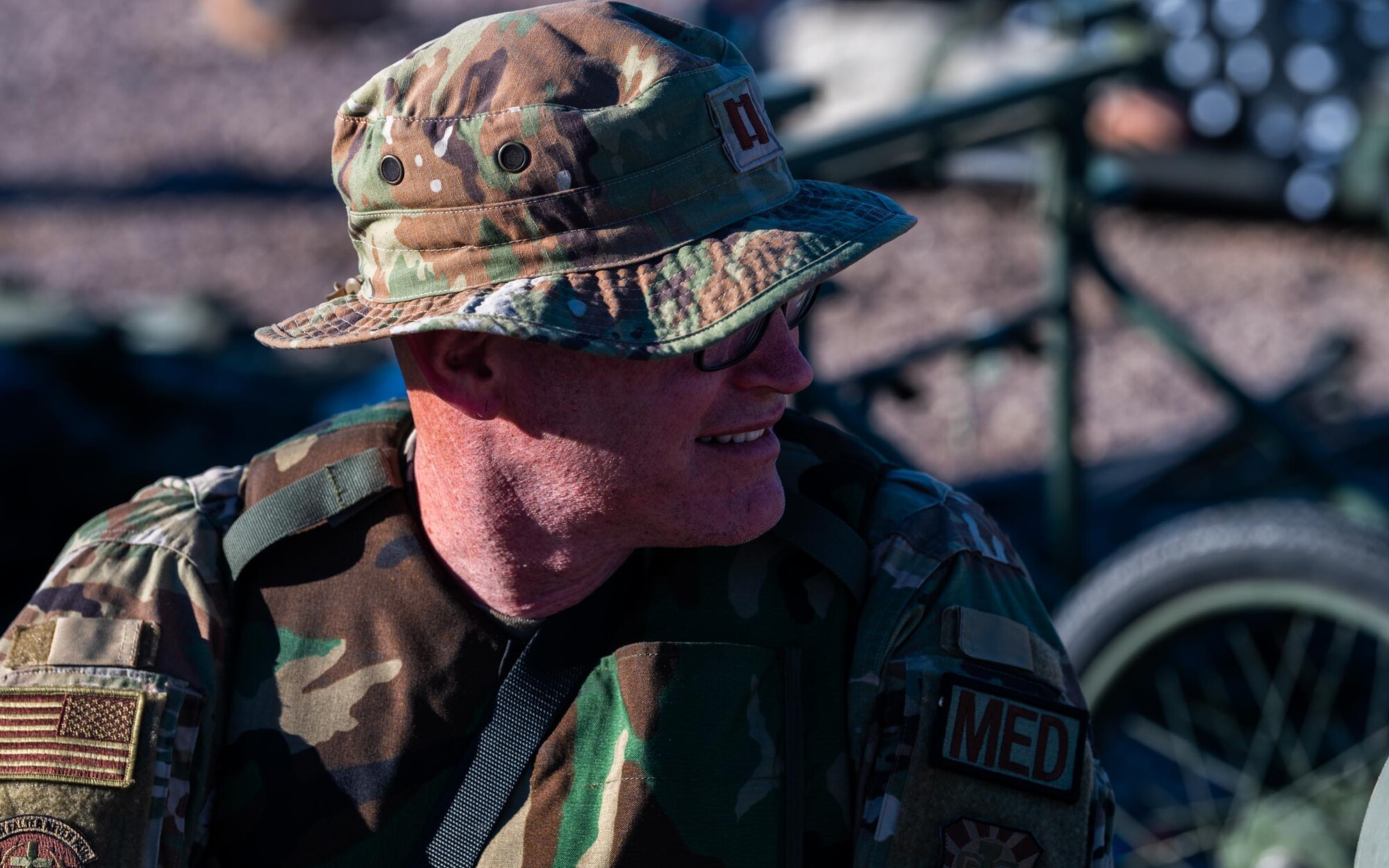 A 944th Fighter Wing U.S. Air Force Reserve Citizen Airman medical officer observes a tactical field environment at Auxiliary Airfield 6 near Gila Bend, Ariz., Nov. 14, 2024. Through joint and multinational collaboration, Desert Hammer tests the ability of over 700 participants and 131 aircraft to operate, defend, and sustain airbases under austere conditions. (U.S. Air Force photo by Senior Airman Jacob Dastas)