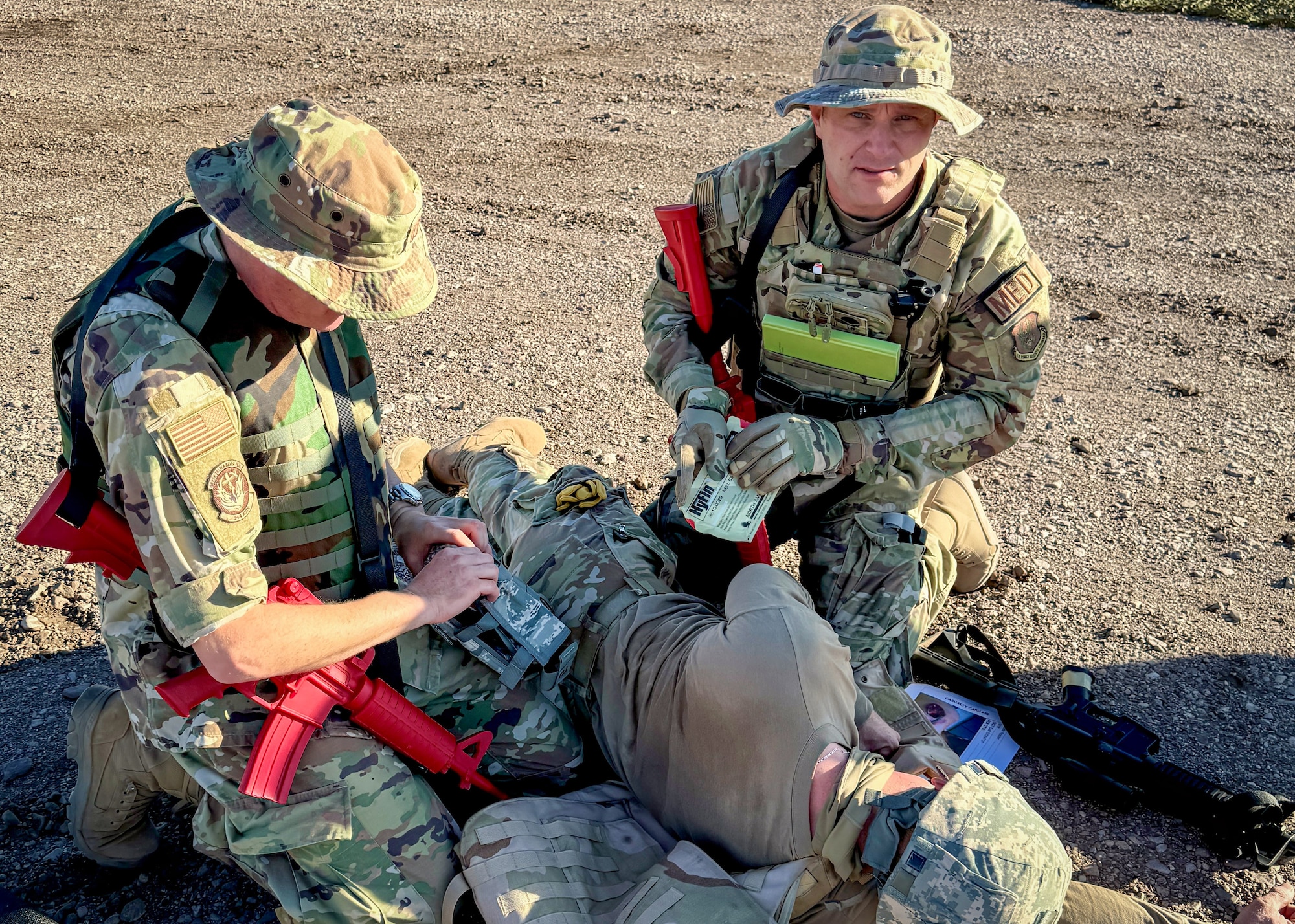 944th Fighter Wing Reserve Citizen Airmen provide life-saving care to a simulated casualty during Exercise Desert Hammer 25-1 at Gila Bend Air Force Auxiliary Field, Ariz., Nov. 14, 2024. This large-scale exercise showcases the adaptability of Mission Ready Airmen, advancing the skills needed to thrive in the rapidly evolving challenges of global competition. (U.S. Air Force photo by Maj. Casey Staheli)