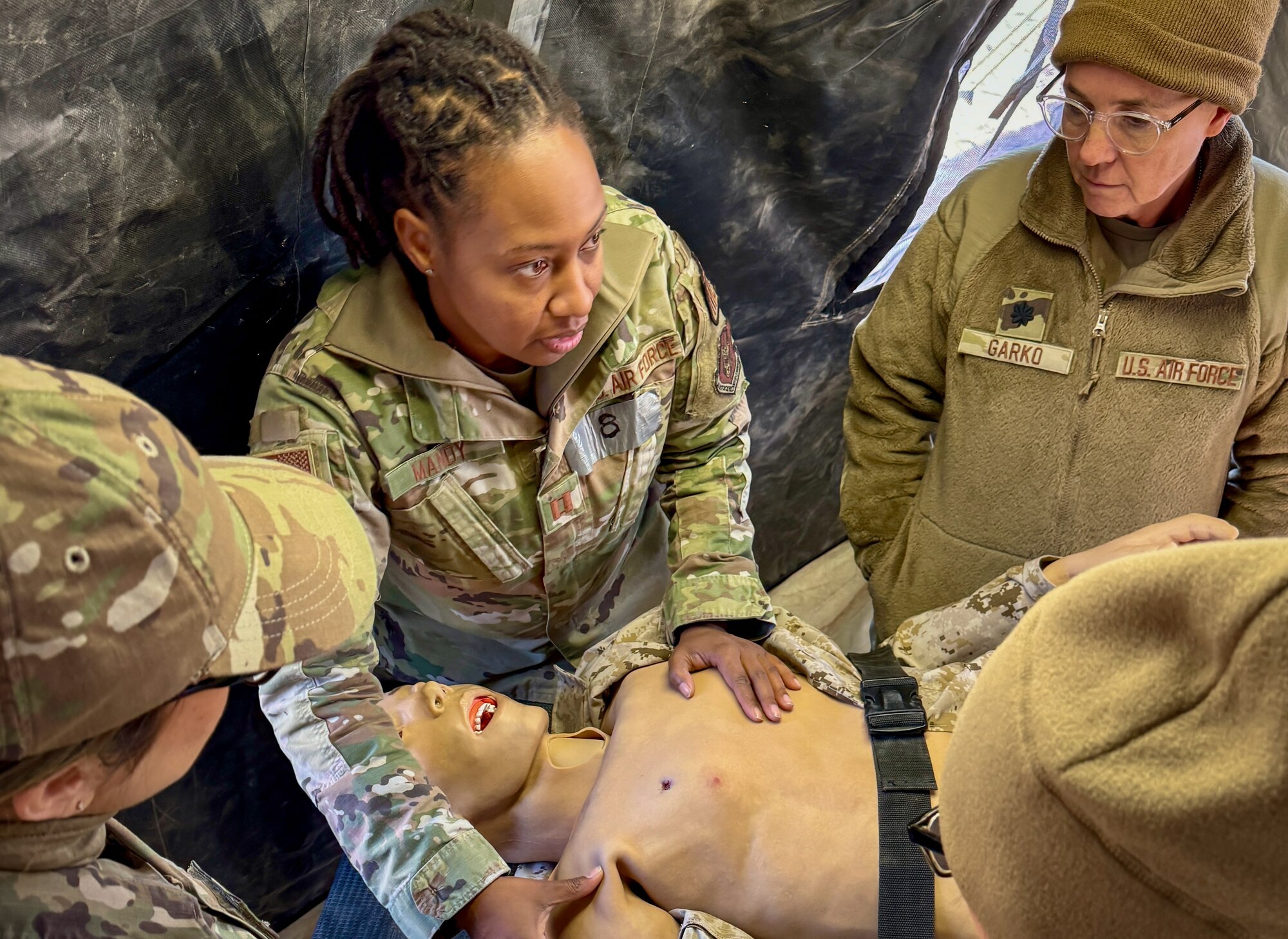 944th Fighter Wing medical Airmen evaluate a training mannequin to practice life-saving techniques during Exercise Desert Hammer 25-1 at Gila Bend Air Force Auxiliary Field, Ariz., Nov. 14, 2024. Through joint and multinational collaboration, Desert Hammer tests the ability of over 700 participants and 131 aircraft to operate, defend, and sustain airbases under austere conditions. (U.S. Air Force photo by Maj. Casey Staheli)