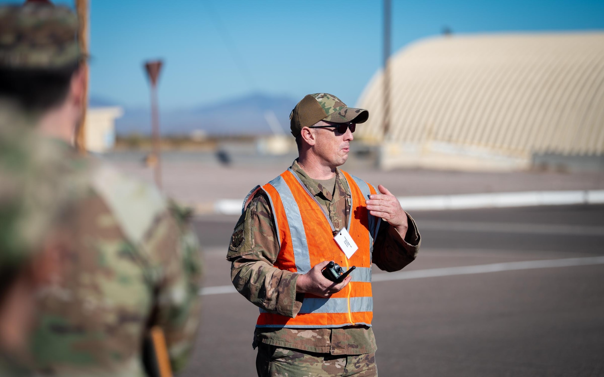 Master Sgt. Matthew Patnaude, one of the primary Exercise Desert Hammer 25-1 planners, briefs 944th Fighter Wing Reserve Citizen Airmen at Gila Bend Air Force Auxiliary Field in Gila Bend, Ariz., Nov. 14, 2024. Through joint and multinational collaboration, Desert Hammer tests the ability of over 700 participants and 131 aircraft to operate, defend, and sustain airbases under austere conditions. (U.S. Air Force photo by Senior Airman Jacob Dastas)