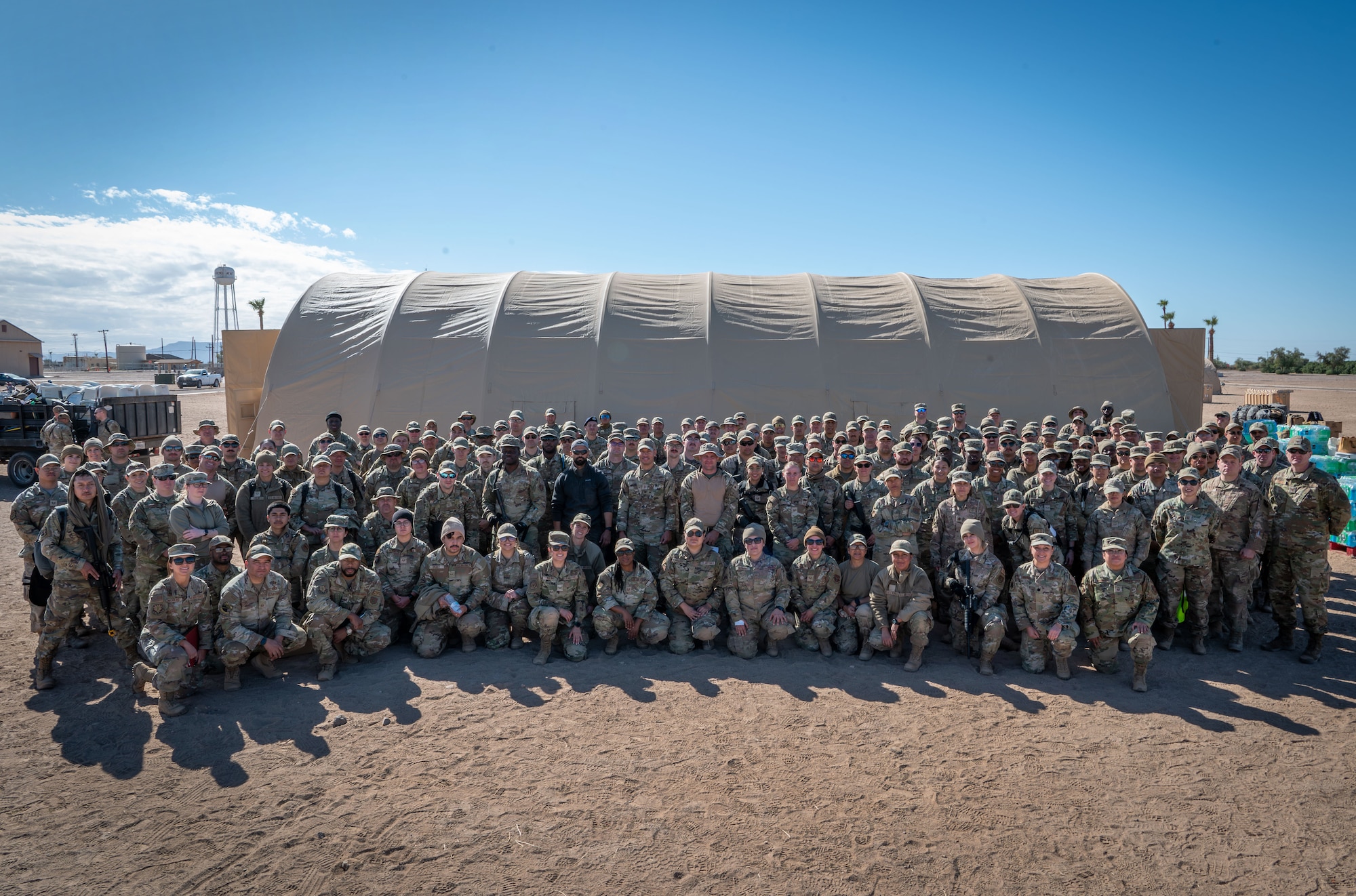 U.S. Air Force Reserve Citizen Airmen from the 944th Fighter Wing gather for a group photo at Gila Bend Air Force Auxiliary Field near Gila Bend, Ariz., Nov. 16, 2024, following the conclusion of Exercise Desert Hammer 25-1. This large-scale exercise showcases the adaptability of Mission Ready Airmen, advancing the skills needed to thrive in the rapidly evolving challenges of global competition. (U.S. Air Force photo by Senior Airman Alexis Orozco)