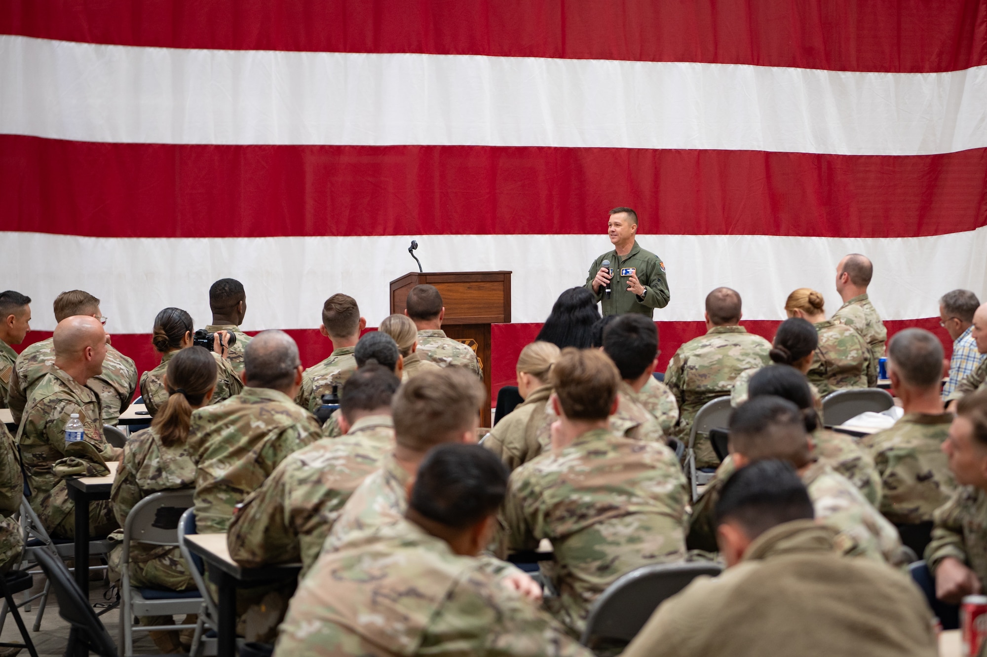 944th Fighter Wing Commander Col. Todd Riddle speaks to the 944th FW Airmen during a homecoming celebration at Luke Air Force Base, Ariz., Nov. 17, 2024, upon the conclusion of Exercise Desert Hammer 25-1. Exercise Desert Hammer 25-1 emphasizes the U.S. Air Force Reserve’s commitment to readiness by integrating Agile Combat Support and Large Force Exercise capabilities in a contested environment. (U.S. Air Force photo by Tech. Sgt. Tyler J. Bolken)
