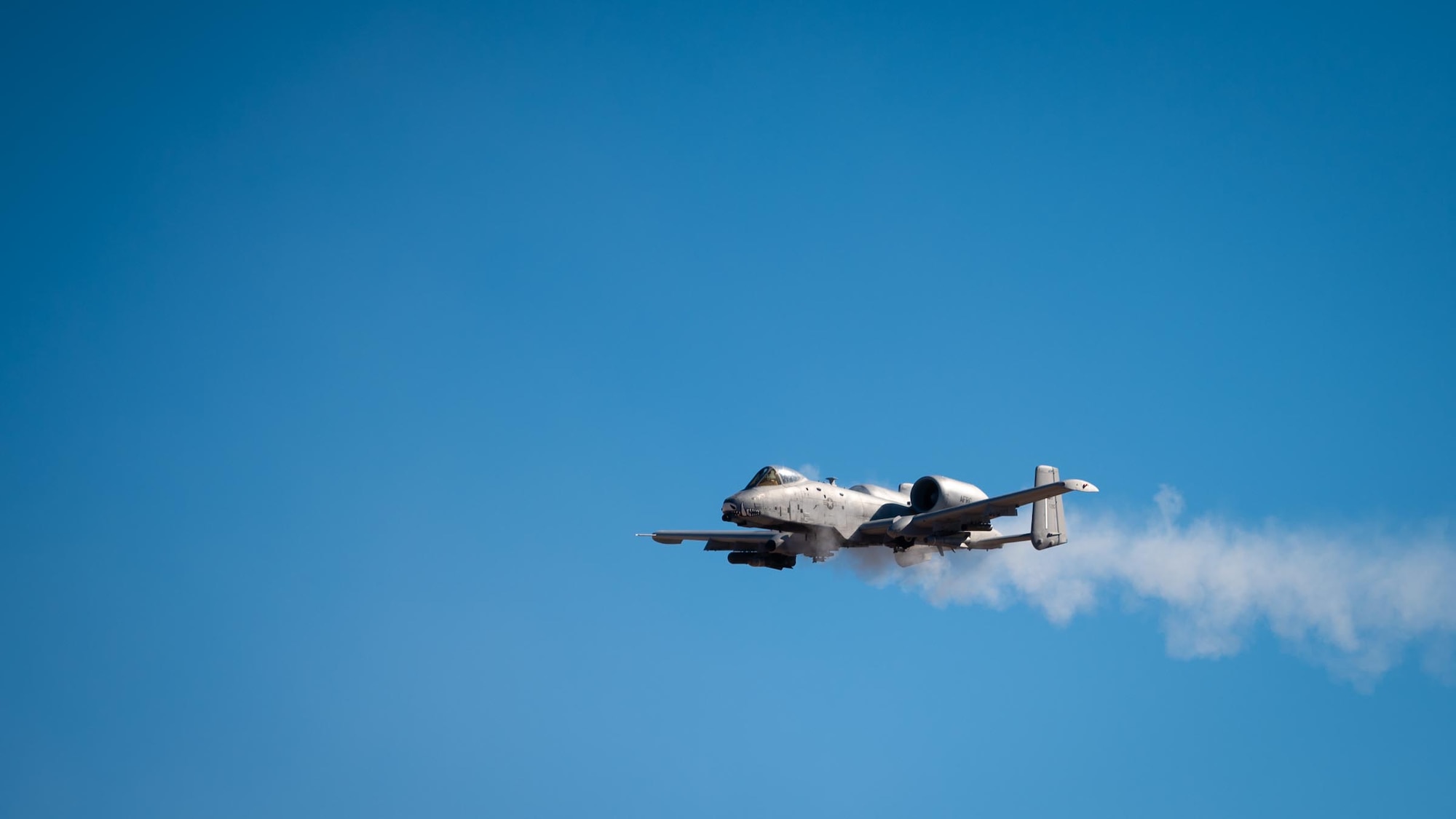 Smoke trails follow an A-10 Thunderbolt II from the 924th Fighter Group of the 944th Fighter Wing as it fires its 30mm GAU-8/A Avenger Gatling gun during Exercise Desert Hammer 25-1 at Barry M. Goldwater Range East near Gila Bend, Ariz., Nov. 14, 2024. Exercise Desert Hammer 25-1 emphasizes the U.S. Air Force Reserve’s commitment to readiness by integrating Agile Combat Support and Large Force Exercise capabilities in a contested environment. (U.S. Air Force photo by Senior Airman Jacob Dastas)