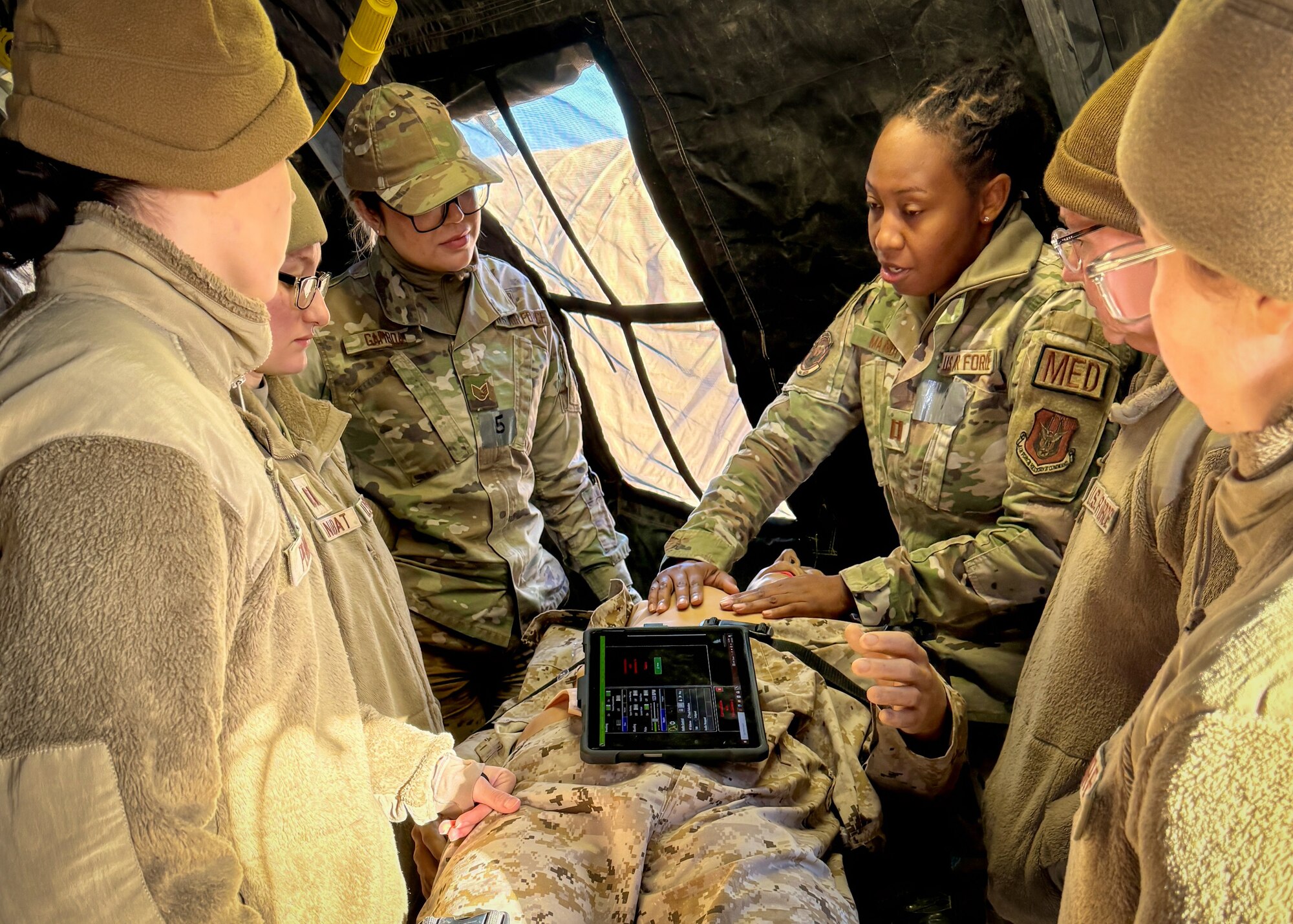 944th Fighter Wing Airmen receive guidance on medical treatment techniques during a tactical care scenario as part of Exercise Desert Hammer 25-1 at Gila Bend Air Force Auxiliary Field, Ariz., Nov. 14, 2024. Set against the unmatched backdrop of the Barry M. Goldwater Range, Desert Hammer leverages Arizona’s strategic geography to provide realistic combat training for U.S. and allied forces. (U.S. Air Force photo by Maj. Casey Staheli)