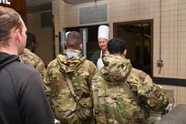 Col. Douglas C. Jeffrey IV 433rd Airlift Wing commander prepares plates of food for service members during the “Feed the Troops” event at the Live Oak Dining Facility on Joint Base San Antonio-Lackland, Texas, Dec. 7, 2024.