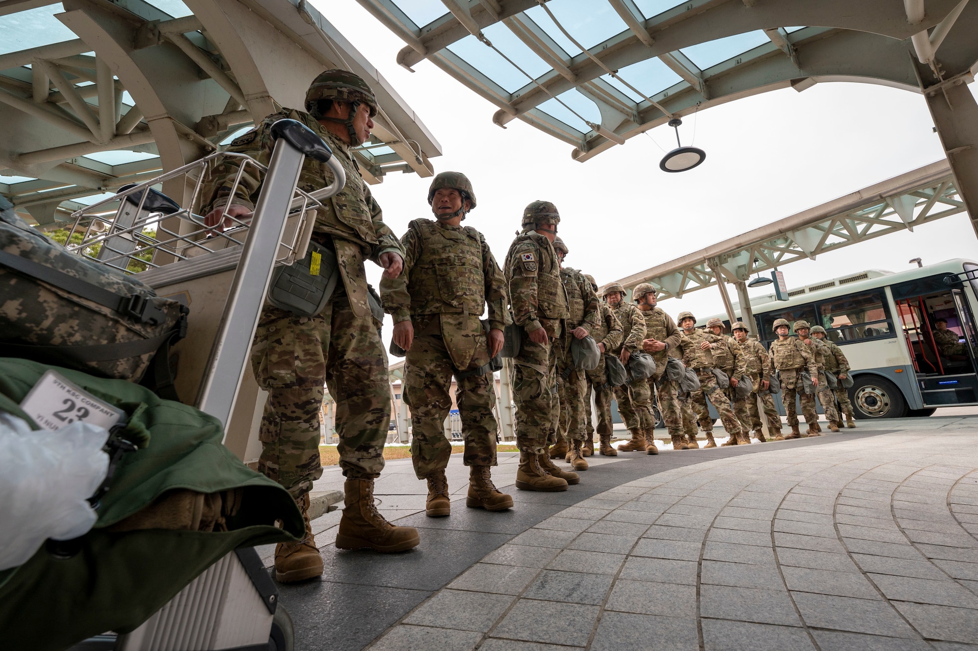 Korean Service Corps Pyeongtaek Mobilization Station members arrive at the Passenger Terminal during a simulated contingency operations training at Osan Air Base, Republic of Korea, Dec. 5, 2024. A total of 32 KSC members joined the joint training thus increasing the 51st Fighter Wing's warfighting and readiness capabilities. (U.S. Air Force photo by Senior Airman Sabrina Fuller-Judd)