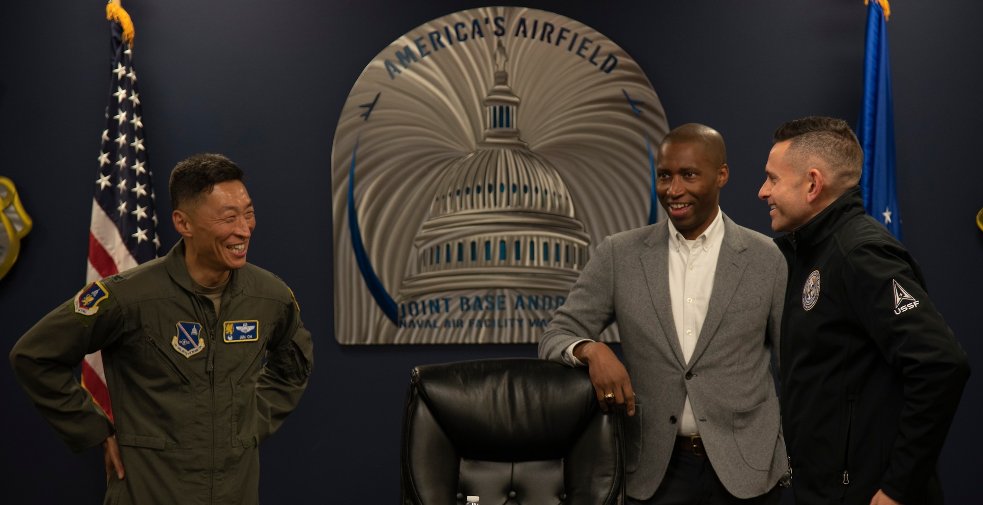 From left, U.S. Air Force Col. Jun Oh, 316th Wing and installation commander, speaks with Anthony Woods, secretary of the Maryland Department of Veterans and Military Families, and the Honorable Alex Wagner, assistant secretary of the Air Force for Manpower and Reserve Affairs.