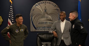 From left, U.S. Air Force Col. Jun Oh, 316th Wing and installation commander, speaks with Anthony Woods, secretary of the Maryland Department of Veterans and Military Families, and the Honorable Alex Wagner, assistant secretary of the Air Force for Manpower and Reserve Affairs.