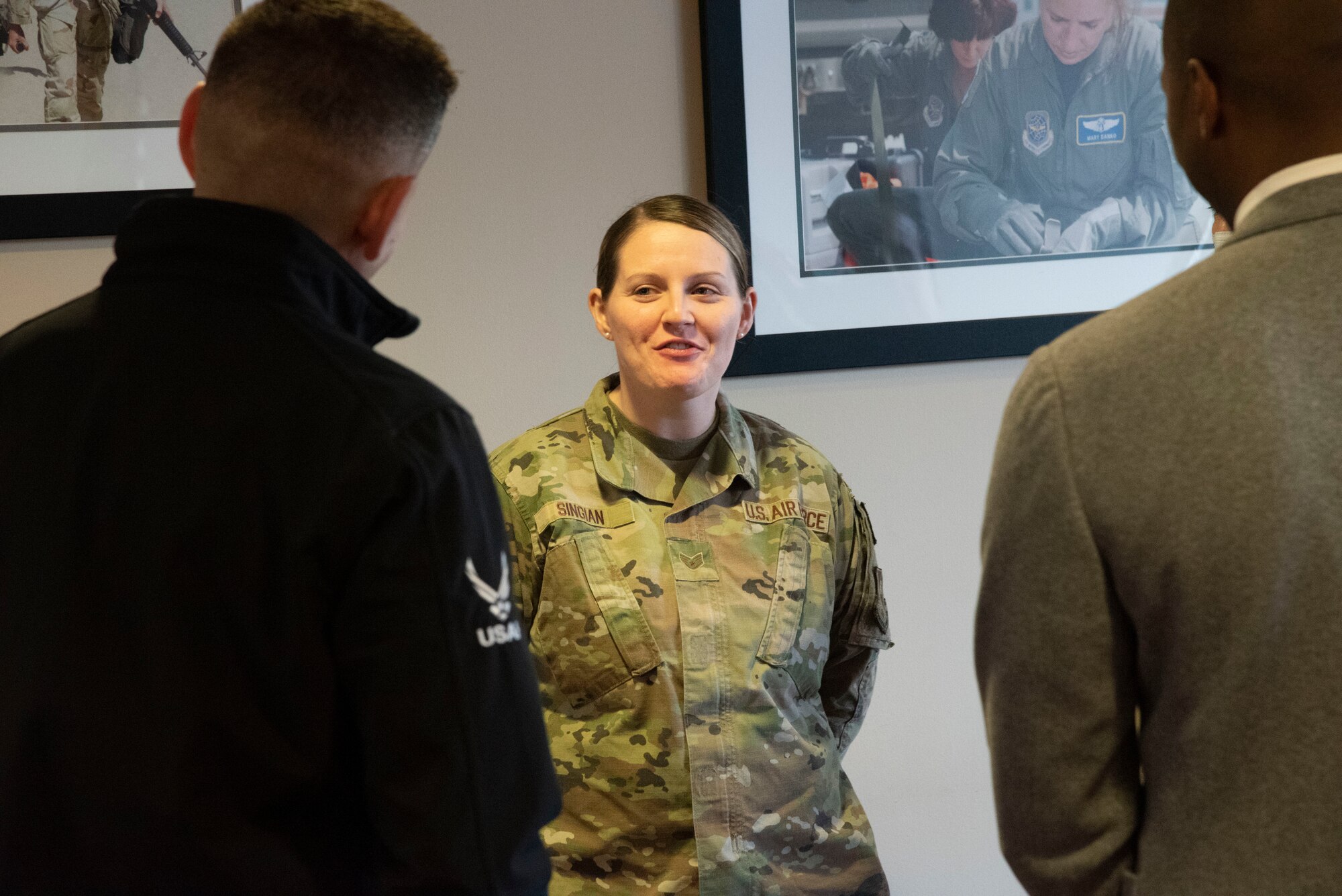 U.S. Air Force Staff Sgt. Ashlea Singian, 316th Medical Squadron noncommissioned officer in charge of medical readiness, speaks with the Honorable Alex Wagner, assistant secretary of the Air Force for Manpower and Reserve Affairs, and Anthony Woods, secretary of the Maryland Department of Veterans and Military Families.