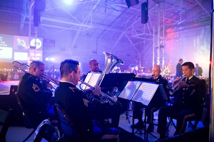 The Oklahoma National Guard's 145th Army Band performs at the eighth annual Oklahoma Women in Aviation & Aerospace Day at the Tulsa Air National Guard Base, Okla., Dec. 6, 2023. More than 1,000 students and adults in the aerospace industry came to participate in the event which included aircraft and military static displays, a panel discussion, guest speakers, and more. (Oklahoma Air National Guard photo by Master Sgt. Rebecca Imwalle)