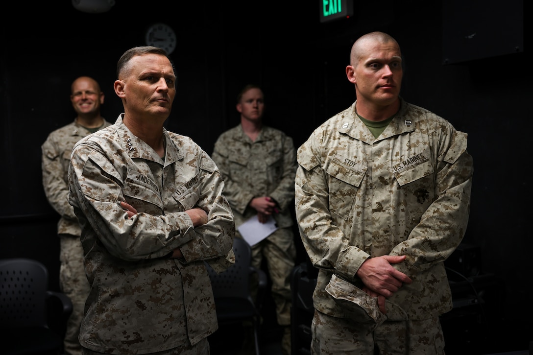 U.S. Marine Corps Lt. Gen. Leonard F. Anderson IV, left, Duluth, Minnesota native, commander of Marine Forces Reserve and Marine Forces South, tours the combat operations center alongside Capt. Travis Stoy, right, infantry officer, Echo Company, 4th Light Armored Reconnaissance Battalion, 4th Marine Division, during an adversarial force exercise at Marine Air Ground Combat Center, Twentynine Palms, California, Dec. 2, 2024. The unit will spend the coming months focusing on different military operations in an urban terrain to prepare for its deployment to Okinawa, Japan, ensuring the Marines are fully manned, trained and equipped to meet mission challenges. (U.S. Marine Corps photo by Cpl. Madisyn Paschal)
