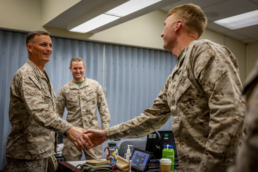 U.S. Marine Corps Lt. Gen. Leonard F. Anderson IV, commander of Marine Forces Reserve and Marine Forces South, greets leadership with 2nd Battalion, 23rd Marine Regiment, 4th Marine Division, during an adversarial force exercise at Marine Air Ground Combat Center, Twentynine Palms, California, Dec. 2, 2024. Anderson met with leadership to discuss the unit’s upcoming deployment to Okinawa, Japan, in support of the Marine Corps’ Unit Deployment Program. This marks the first time since 2020 that an entire Reserve infantry battalion has been activated to support the UDP. (U.S. Marine Corps photo by Cpl. Madisyn Paschal)