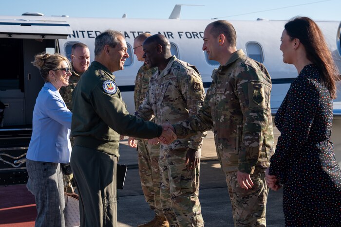 Gen. Ken Wilsbach, commander of Air Combat Command, Cindy Wilsbach, wife of Gen. Wilsbach, and Chief Master Sgt. Dave Wolfe, ACC command chief, greet Robins Air Force Base leadership and their spouses after arriving for a tour