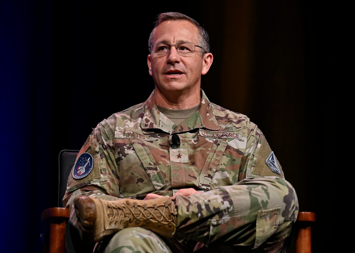 Military member speaks on a panel.