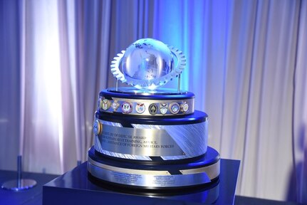2021 Secretary of Defense Award for Sustainment Training, Advice, and Assistance of Foreign Military Forces sits on a table.