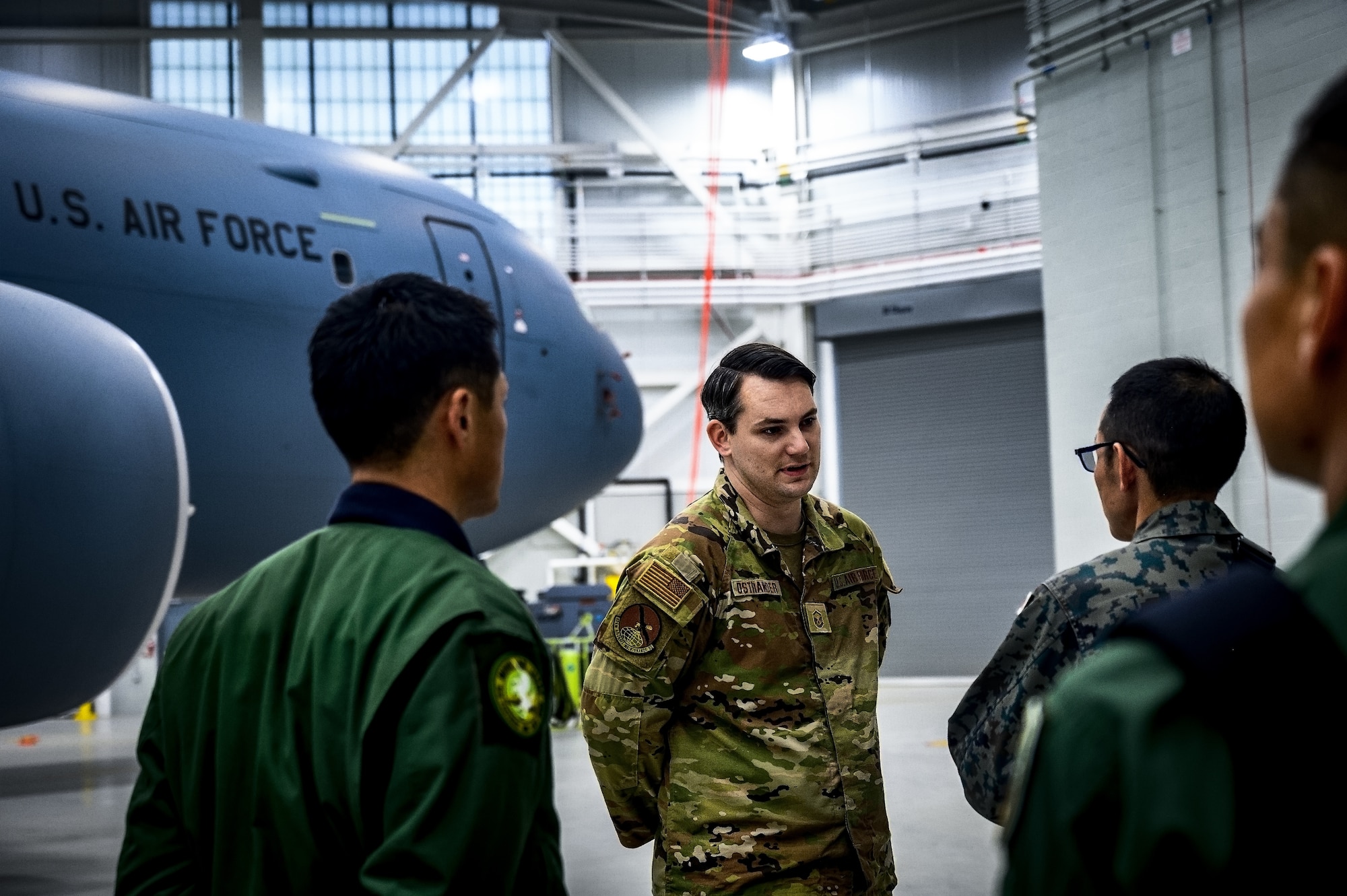 U.S. Air Force Master Sgt. Justin Ostrander, 605th Aircraft Maintenance Squadron crew chief, instructs Japan Air Self-Defense Force Airmen assigned to the 3rd Tactical Airlift Wing at Joint Base McGuire-Dix-Lakehurst, N.J., Dec. 10, 2024. The JASDF visit involved a subject matter expert exchange designed to enhance interoperability with U.S. Air Force KC-46A aircraft units. (U.S. Air Force photo by Senior Airman Matt Porter)