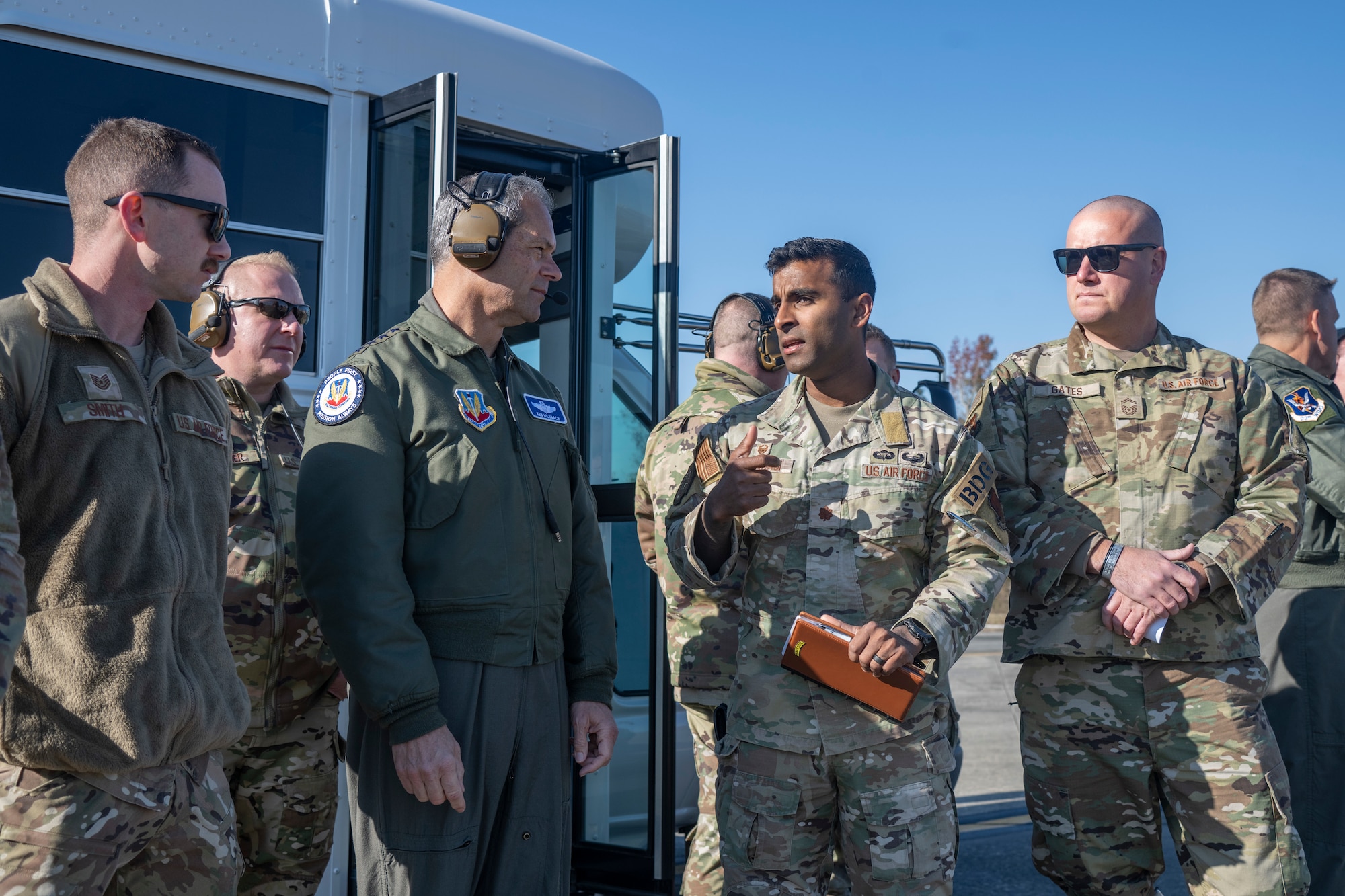 U.S. Air Force Gen. Ken Wilsbach, commander of Air Combat Command, speaks with Maj. Keven Abraham,