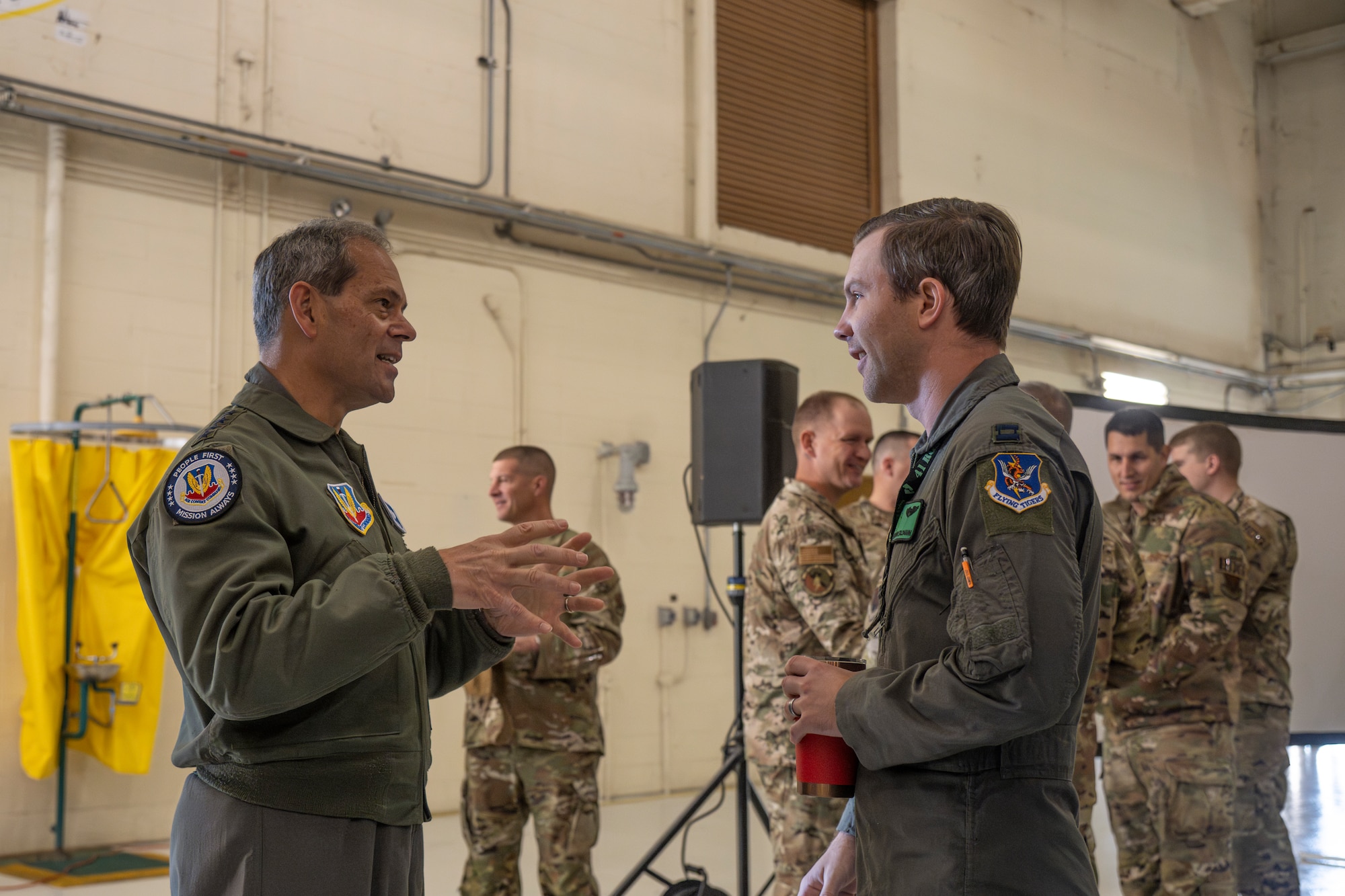General Wilsbach speaks with an Airman following an all call