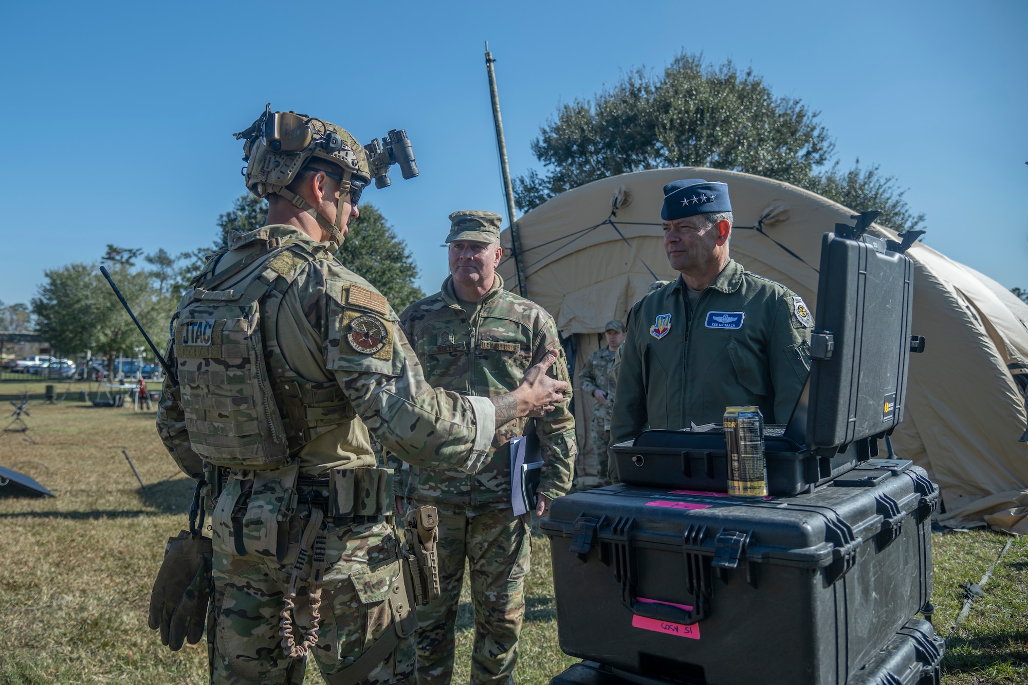 U.S. Air Force Gen. Ken Wilsbach, commander of Air Combat Command and Chief Master Sgt. Dave Wolfe, ACC command chief, speaks with Capt. Mati Selazek
