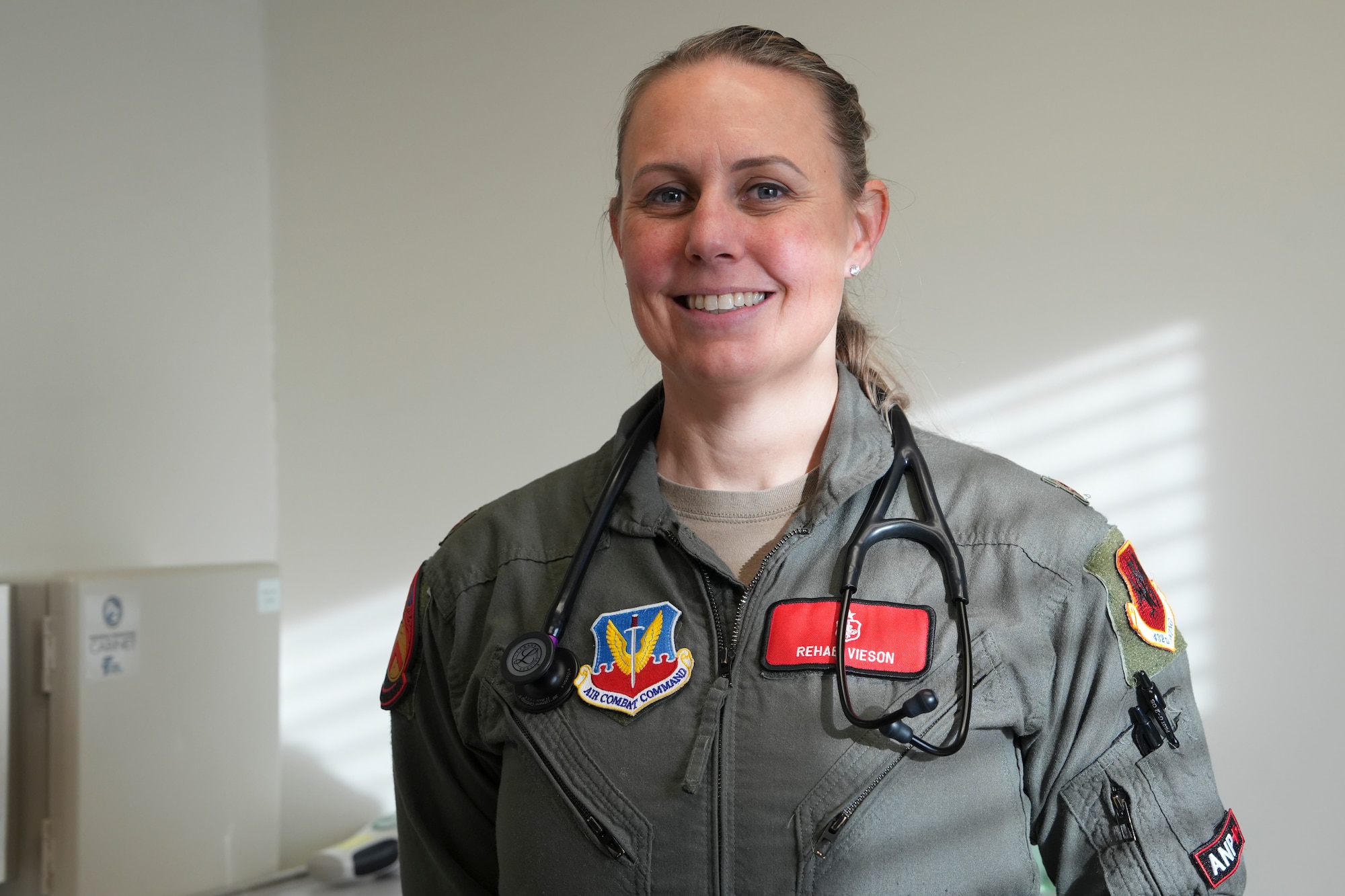 An airman stands for a portrait.