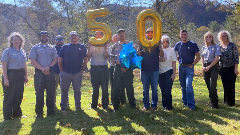 The staff at Dale Hollow Lake celebrates Park Ranger Bobby Bartlett’s half century of service to the U.S. Army Corps of Engineers Nashville District near the Resource Manager’s Office Oct. 29, 2024, in Celina, Tennessee. He began working for the Corps of Engineers in 1985 and has since held multiple positions as a park host, maintenance worker, park technician, and park ranger. (USACE Photo by Crystal Tingle)