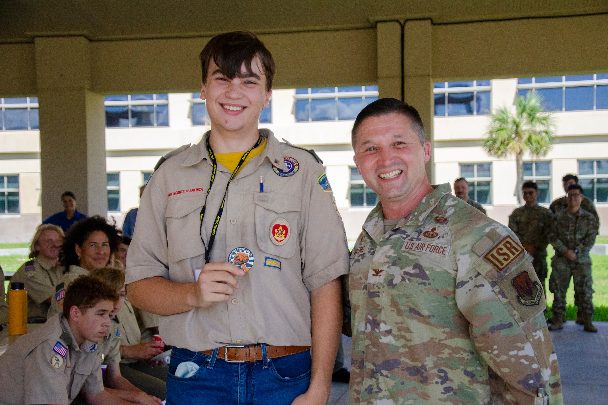 Jesse Portz, a 10th grader and member of Troop 306 in DeBary, Fla., displays the challenge coin he received from Col. Creighton Mullins, commander of the Air Force Technical Applications Center at Patrick Space Force Base, Fla., during AFTAC’s annual Nuclear Science Merit Badge event.  (U.S. Air Force photo by Susan A. Romano)