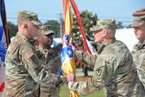 Gen. Ed Daly passes the U.S. Army Security Assistance Command flag to Brig. Gen. Garrick Harmon