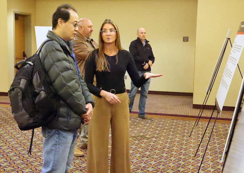 Man and woman talking at a conference