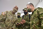 Senior enlisted advisors for the Colombian Army brief Command Sgt. Maj. Sean Rice, the senior enlisted advisor for U.S. Army Security Assistance Command