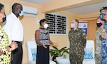 U.S. Army South Deputy Commanding General for Interoperability, Brigadier General Alcides V. Faria, (4th-l) listens keenly to Minister of State, Ministry of Health & Wellness, The Hon. Juliet Cuthbert Flyn, OD MP, during a recent tour of the U.S. funded mobile field hospital, based at the Spanis