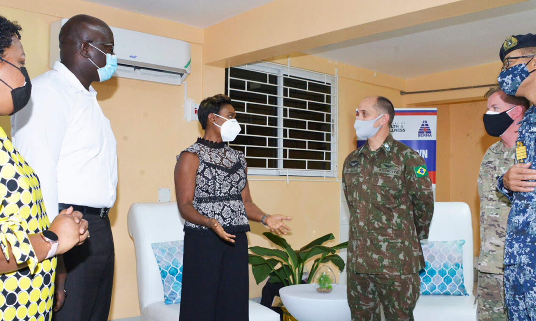 U.S. Army South Deputy Commanding General for Interoperability, Brigadier General Alcides V. Faria, (4th-l) listens keenly to Minister of State, Ministry of Health & Wellness, The Hon. Juliet Cuthbert Flyn, OD MP, during a recent tour of the U.S. funded mobile field hospital, based at the Spanis
