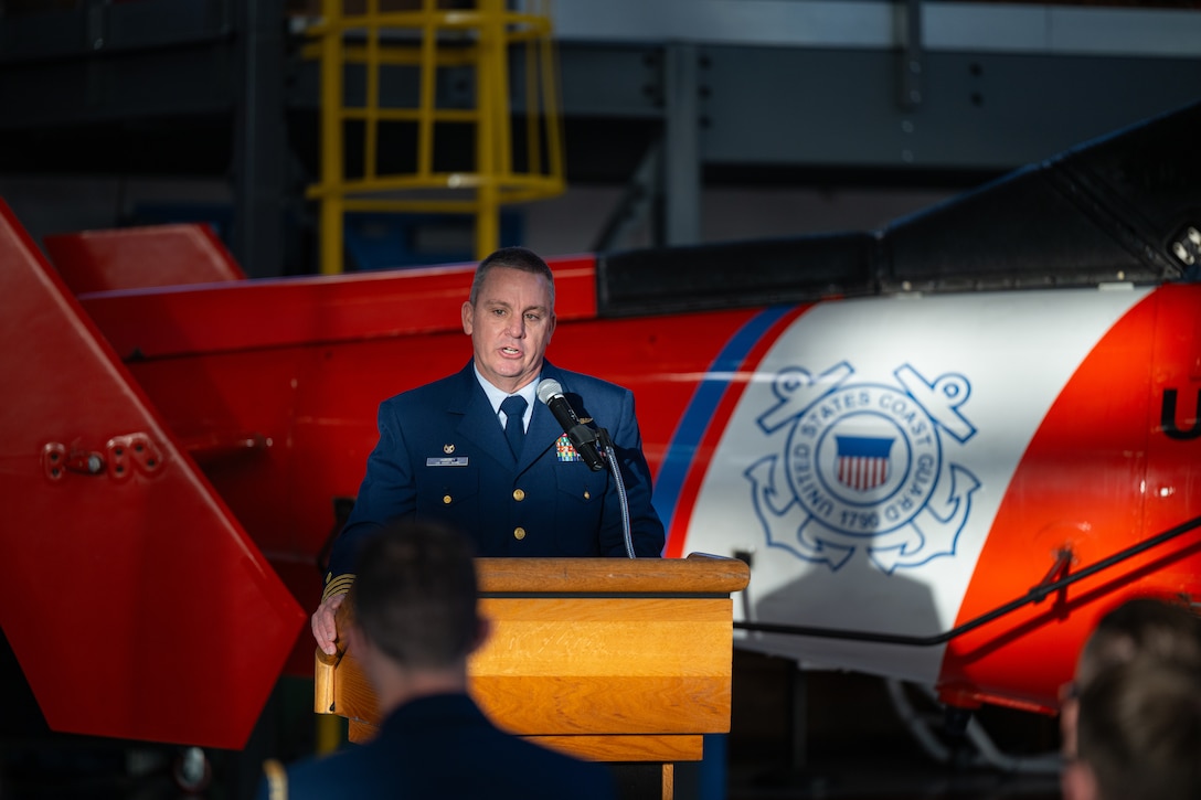 Capt. Christopher Huberty, commanding officer of Coast Guard Air Station San Francisco, speaks during an award ceremony at Air Station San Francisco, Dec. 12, 2024. During the ceremony, Lt. Cmdr. Jacob Conrad was awarded the Distinguished Flying Cross Medal for his actions during a search and rescue case, Dec. 29, 2023. (U.S. Coast Guard photo by Petty Officer 3rd Class Hunter Schnabel)