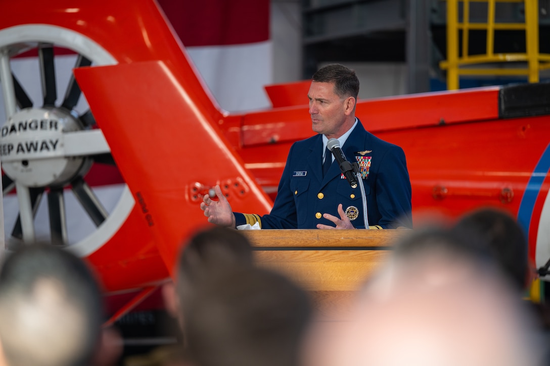 Rear Adm. Joseph Buzzella, commander of Coast Guard District 11, speaks during an award ceremony at Air Station San Francisco, Dec. 12, 2024. During the ceremony, Lt. Cmdr. Jacob Conrad was awarded the Distinguished Flying Cross Medal for his actions during a search and rescue case, Dec. 29, 2023. (U.S. Coast Guard photo by Petty Officer 3rd Class Hunter Schnabel)