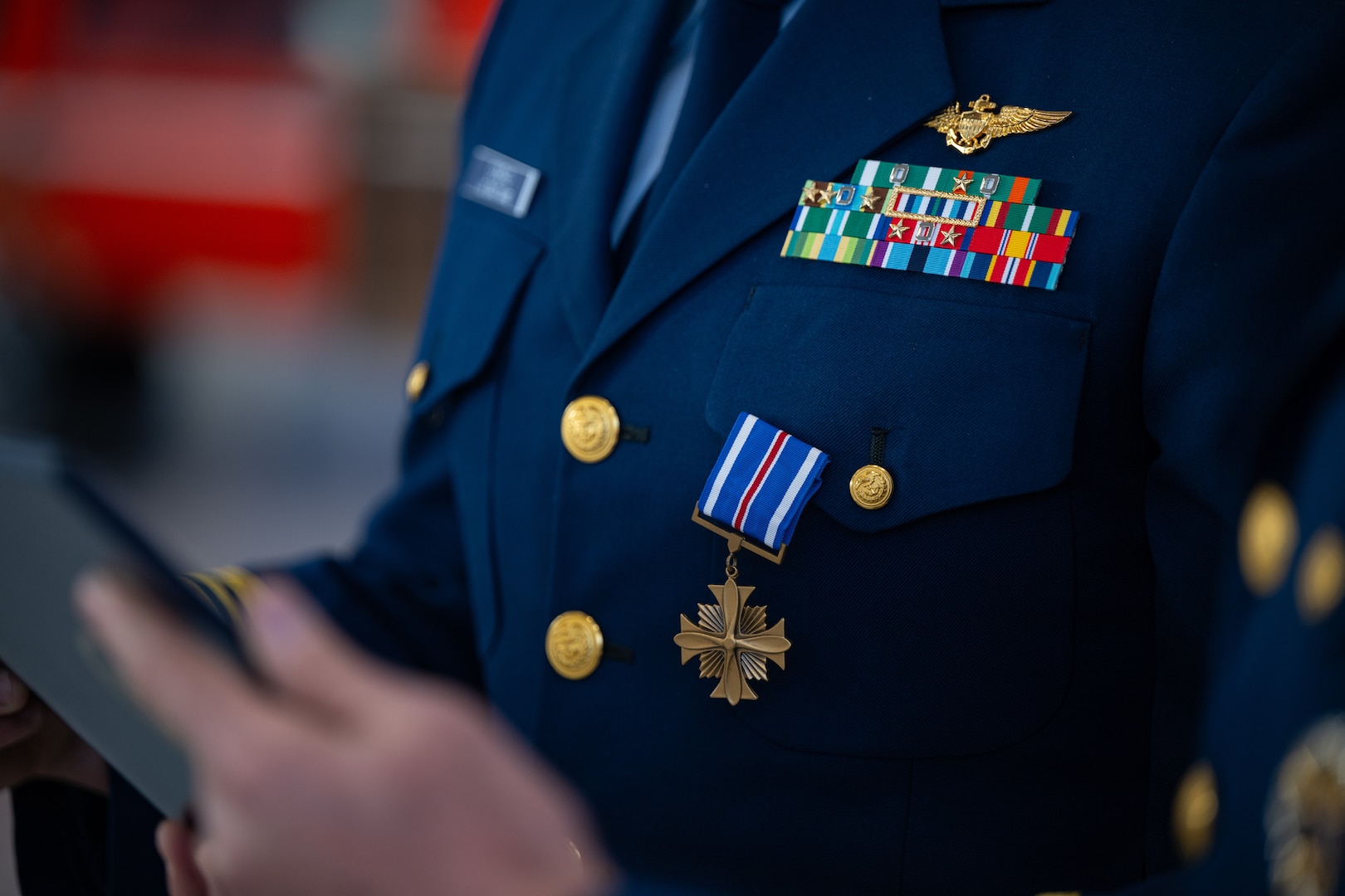 A Distinguished Flying Cross Medal as seen on Lt. Cmdr. Jacob Conrad’s uniform during an award ceremony at Air Station San Francisco, Dec. 12, 2024. During the ceremony, Lt. Cmdr. Jacob Conrad was awarded the Distinguished Flying Cross Medal for his actions during a search and rescue case, Dec. 30, 2023. (U.S. Coast Guard photo by Petty Officer 3rd Class Hunter Schnabel)