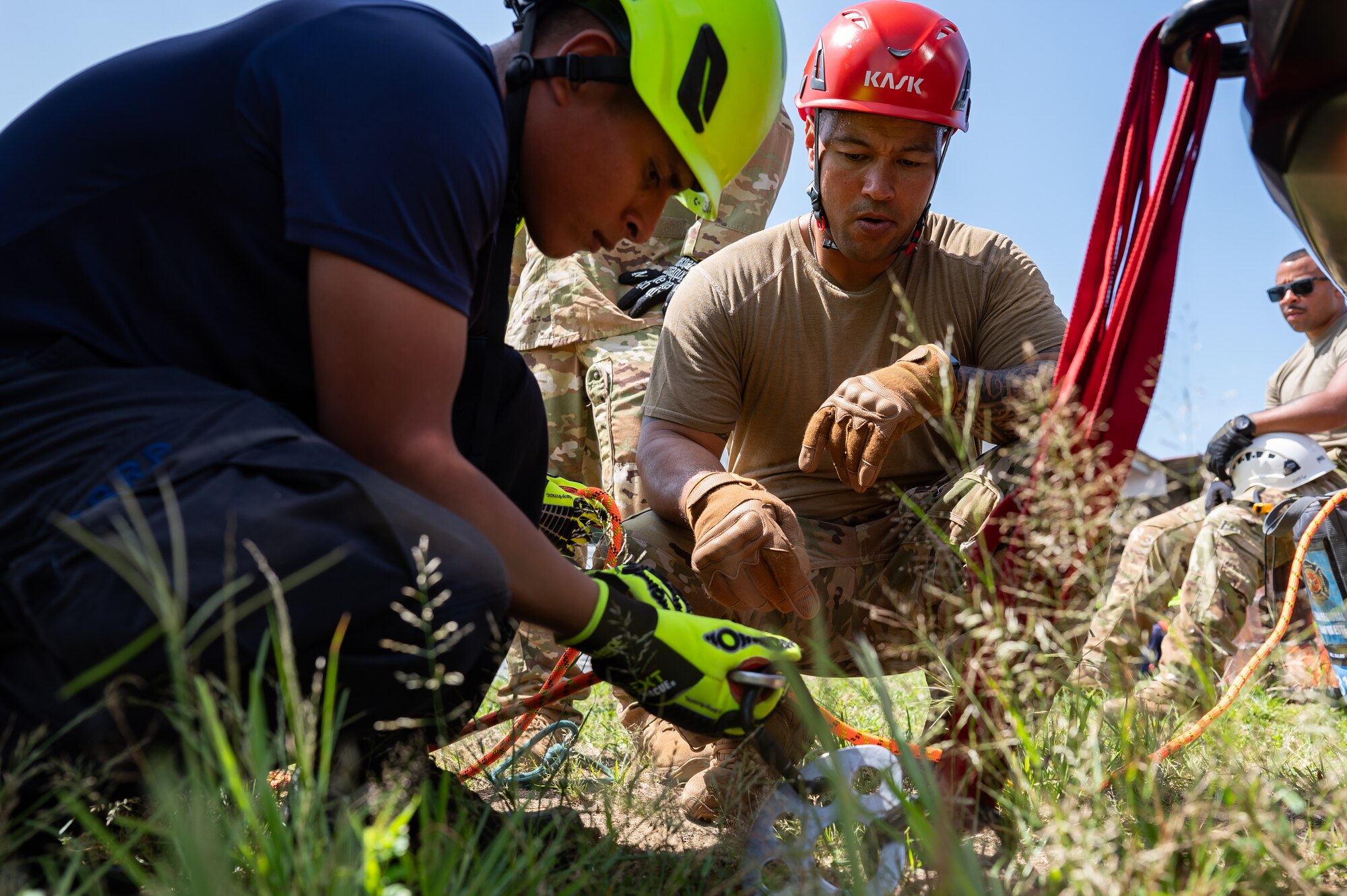 U.S. Air Force Tech. Sgt Justin Rico, Joint Task Force-Bravo firefighter, teaches a Panama firefighter how to properly hook up a hoist during a training exercise in Chepo, Panama, Dec. 11, 2024.