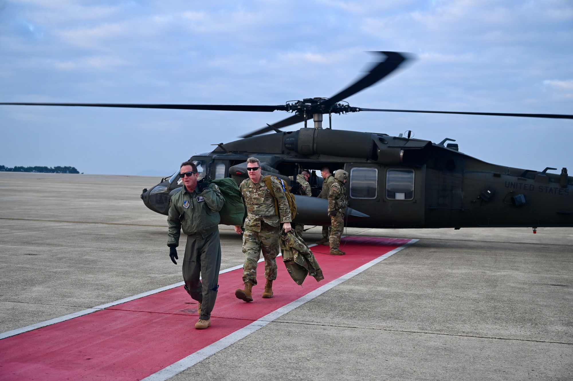 U.S. Air Force Lt. Gen. David R. Iverson, Seventh Air Force commander, and Chief Master Sgt. Jeremiah W. Ross, Seventh Air Force command chief, arrive at Kunsan Air Base, Republic of Korea.