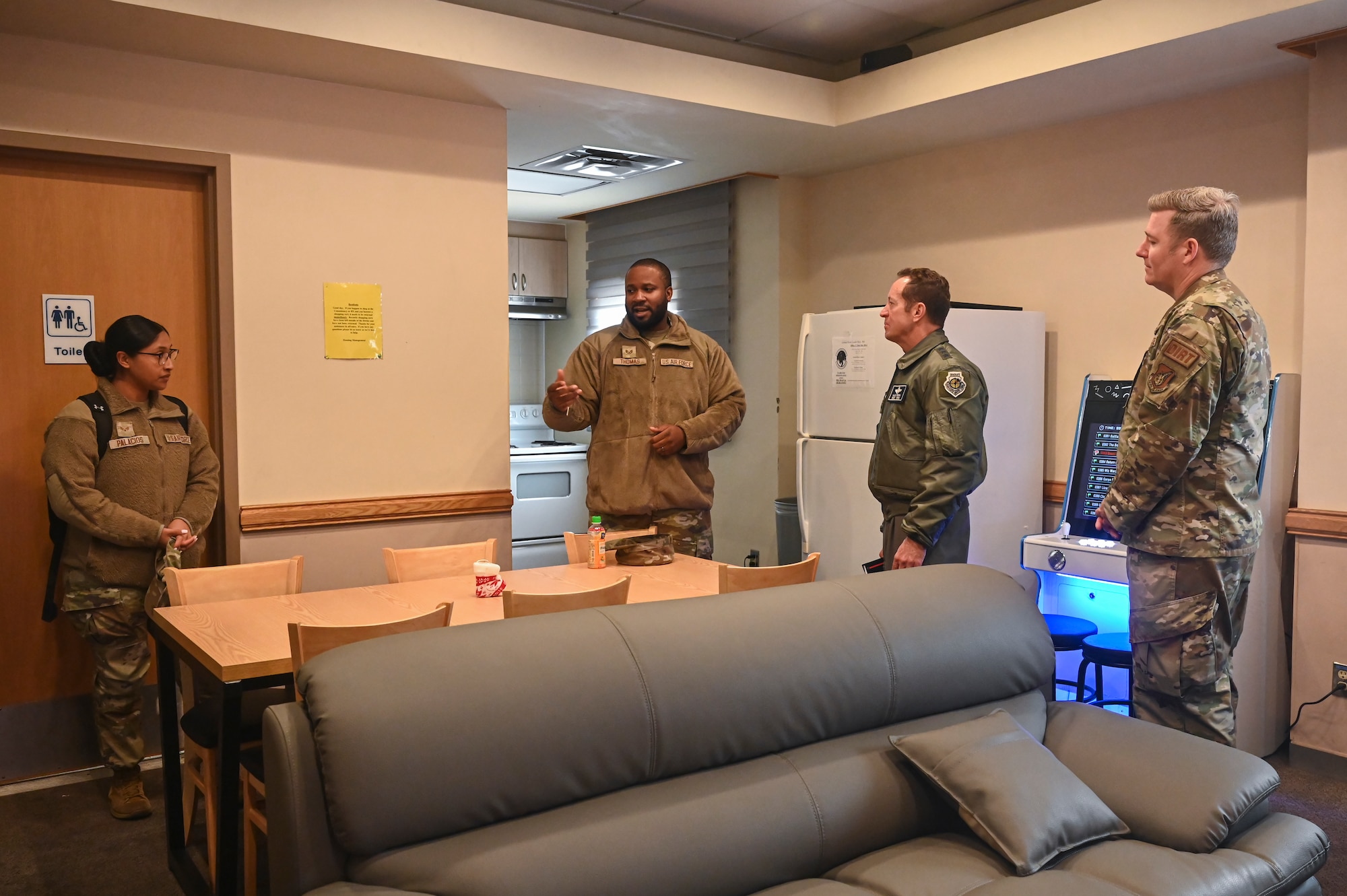 U.S. Air Force Staff Sgt. Deandre Thomas, 8th Civil Engineer Squadron Airman Dorm Leader, briefs Lt. Gen. David R. Iverson, Seventh Air Force commander and Chief Master Sgt. Jeremiah W. Ross, Seventh AF command chief, during their visit at Kunsan Air Base, Republic of Korea.