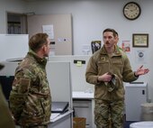 U.S. Air Force Maj. Matthew Bogan, 35th Contracting Squadron commander, explains daily operations to U.S. Air Force Col. Paul Davidson, 35th Fighter Wing commander, during a Wild Weasel Walk-through