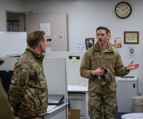 U.S. Air Force Maj. Matthew Bogan, 35th Contracting Squadron commander, explains daily operations to U.S. Air Force Col. Paul Davidson, 35th Fighter Wing commander, during a Wild Weasel Walk-through