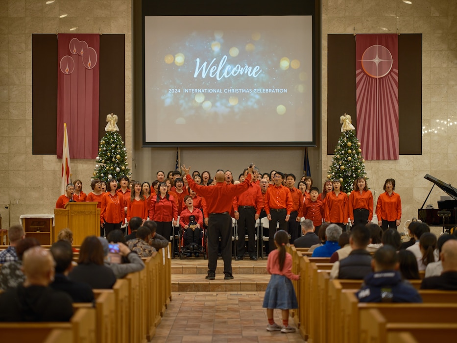 The Yokosuka Citizenship Committee Gospel Choir, a combined worship choir from made up of church members from around the City of Yokosuka, welcome guests to the 2024 International Christmas Celebration at Commander, Fleet Activities Yokosuka's Chapel of Hope Sunday, December 8, 2024.