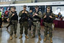 U.S. Marines with the Provost Marshal’s Office, Marine Corps Air Station Futenma pose for a group photo during Comic Con Okinawa 2024 on Camp Foster, Okinawa, Japan, Dec. 8, 2024.