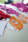 Badges lay on a table to be distributed amongst guests during Comic Con Okinawa 2024 on Camp Foster, Okinawa, Japan, Dec. 8, 2024.